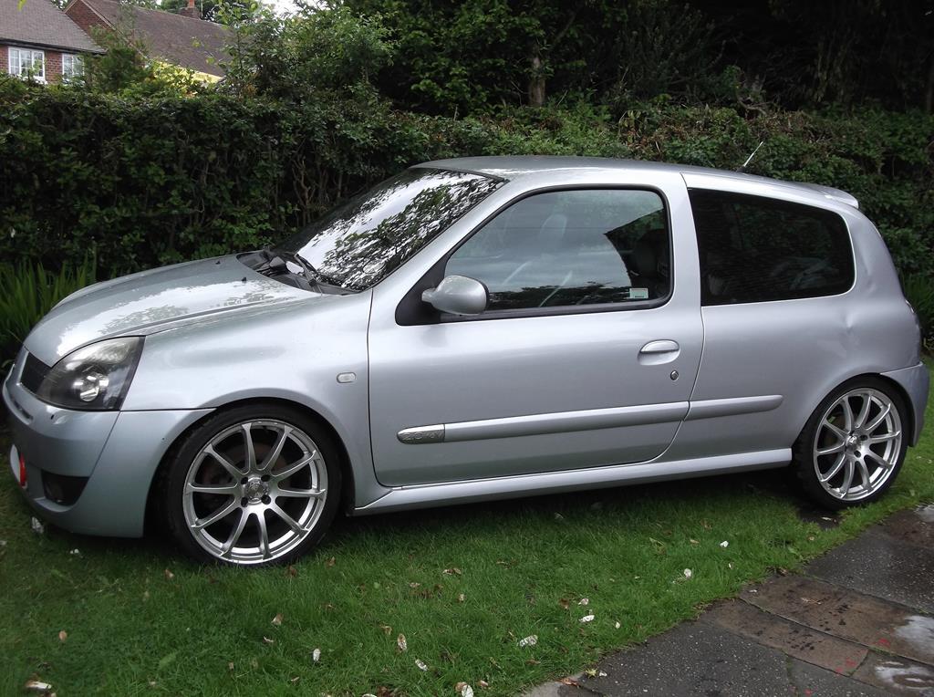Renault clio with oversized alloy wheels on Craiyon