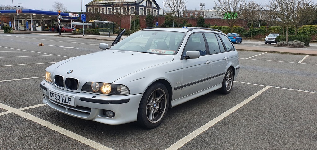 Silver BMW E39 Parked Next to Road